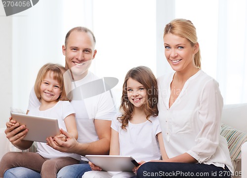 Image of family and two kids with tablet pc computers