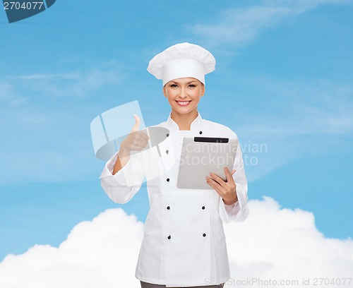 Image of smiling female chef with tablet pc computer