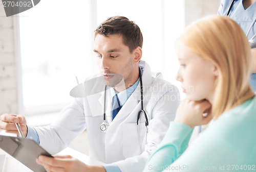 Image of male doctor with patient