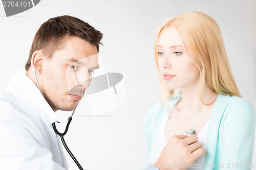 Image of male doctor with patient