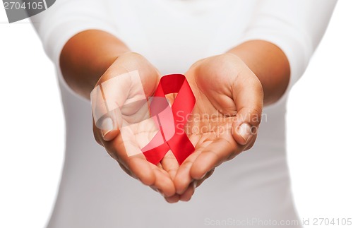 Image of hands holding red AIDS awareness ribbon