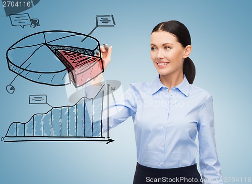 Image of businesswoman drawing pie diagram in the air