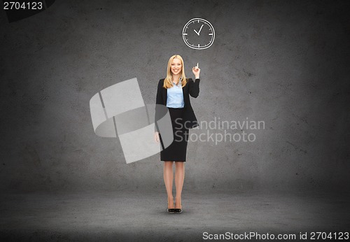 Image of attractive young businesswoman with her finger up