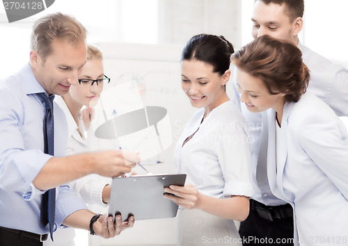 Image of business team discussing something in office