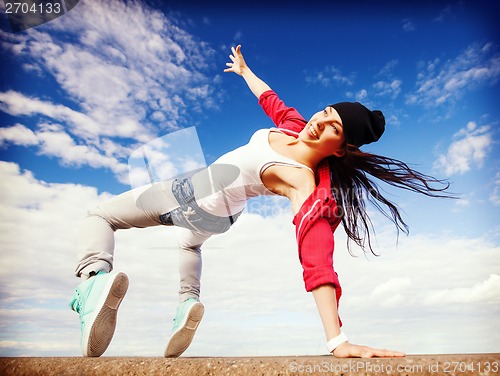 Image of beautiful dancing girl in movement