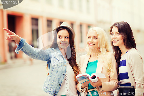 Image of beautiful girls looking for direction in the city