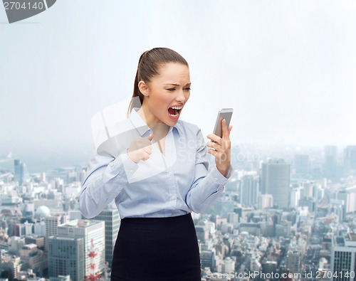 Image of screaming businesswoman with smartphone