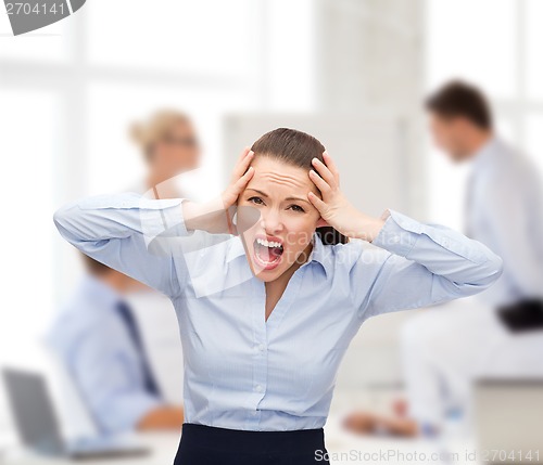 Image of angry screaming businesswoman