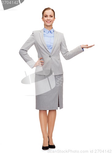 Image of businesswoman showing something on her hand