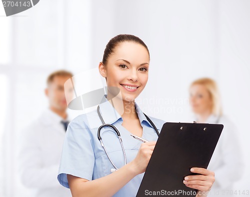 Image of smiling female doctor or nurse with stethoscope