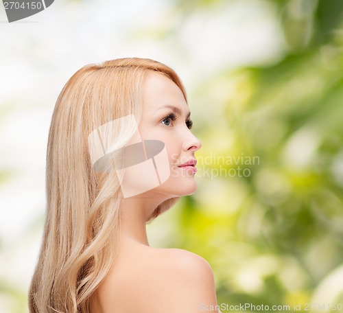 Image of face and shouldes of happy woman with long hair