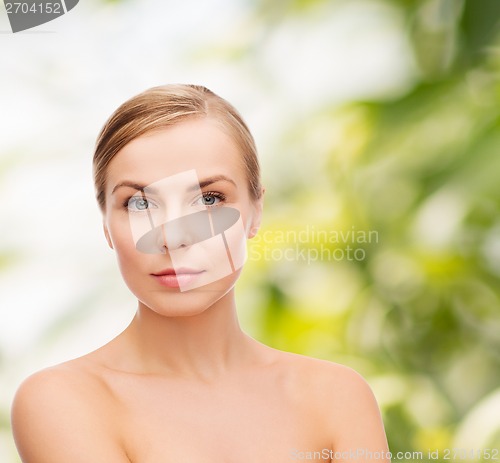 Image of face and shoulders of young woman