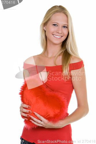 Image of Happy young woman  holding a heart