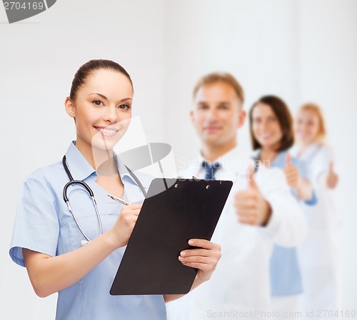 Image of smiling female doctor or nurse with stethoscope