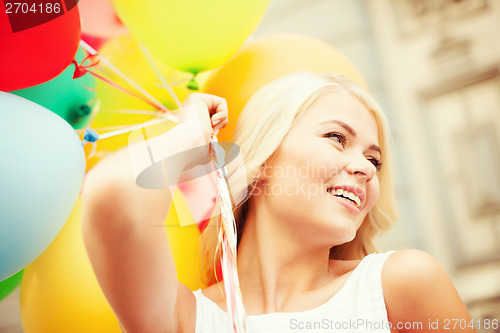 Image of woman with colorful balloons