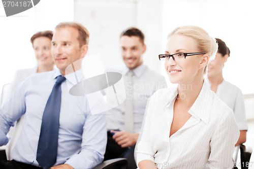 Image of businessmen and businesswomen on conference
