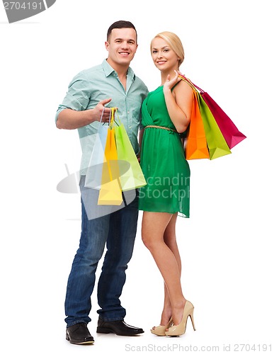 Image of smiling couple with shopping bags