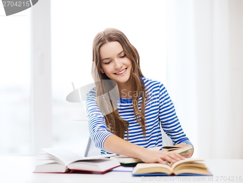 Image of happy smiling student girl with books