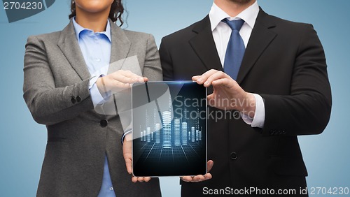 Image of businessman and businesswoman with tablet pc