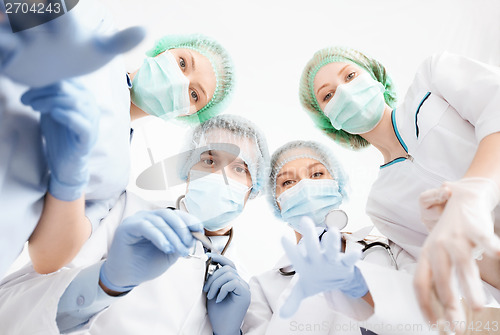 Image of group of doctors in operating room