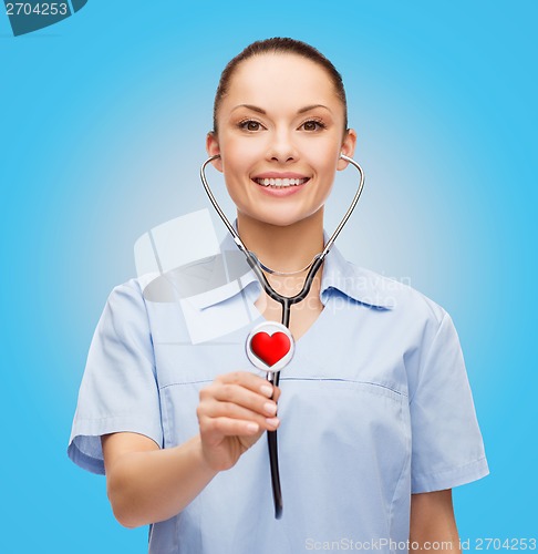 Image of smiling female doctor or nurse with stethoscope