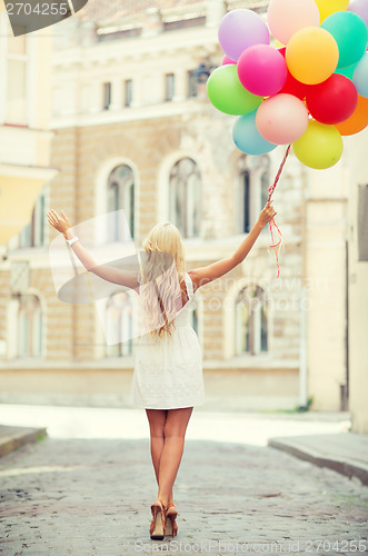 Image of woman with colorful balloons