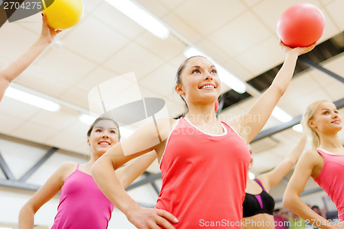 Image of group of people working out with stability balls