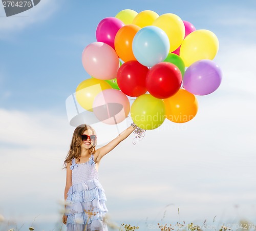 Image of happy girl with colorful balloons