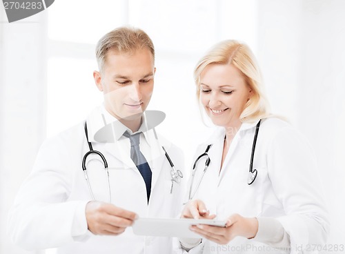 Image of two doctors looking at tablet pc