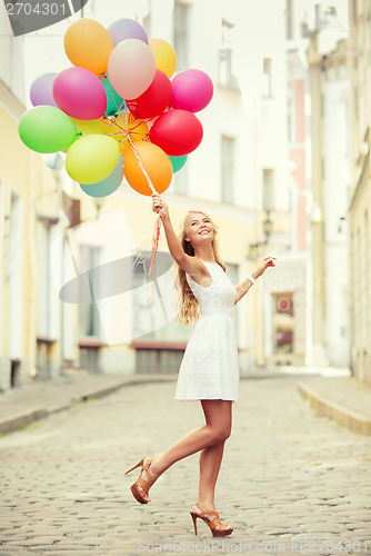 Image of woman with colorful balloons