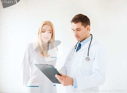 Image of young male doctor and female nurse in hospital