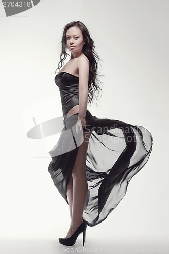 Image of gorgeous asian woman in black dress