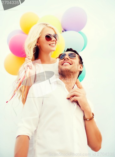 Image of couple with colorful balloons