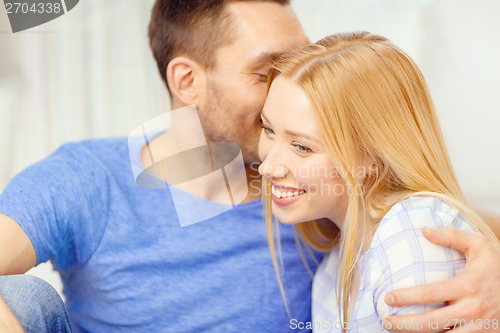 Image of smiling happy couple at home