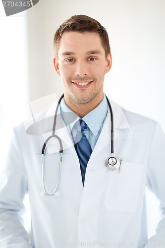 Image of young male doctor with stethoscope in hospital