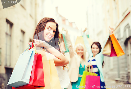 Image of girls with shopping bags in city