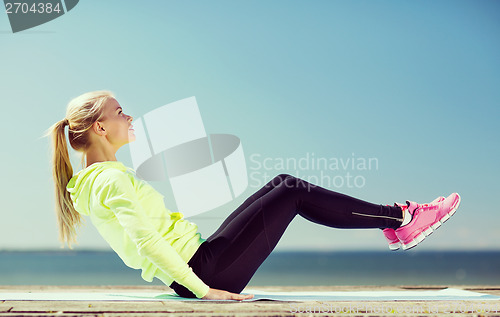 Image of woman doing sports outdoors