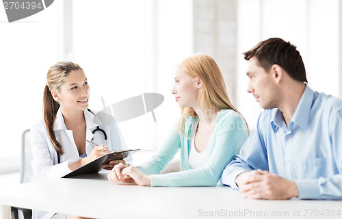 Image of doctor with patients in cabinet