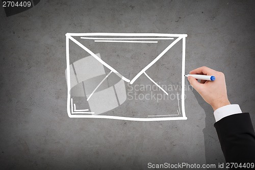 Image of close up of businessman drawing envelope