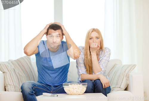 Image of upset couple after sports team loss