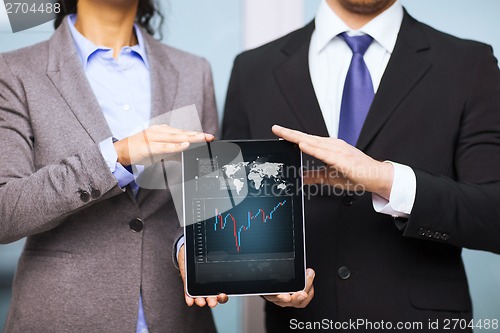 Image of businessman and businesswoman with tablet pc