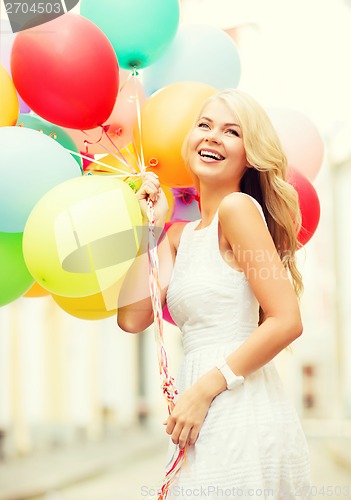 Image of woman with colorful balloons