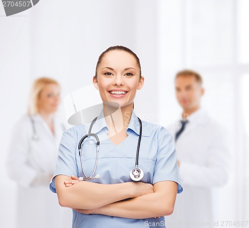 Image of smiling female doctor or nurse with stethoscope