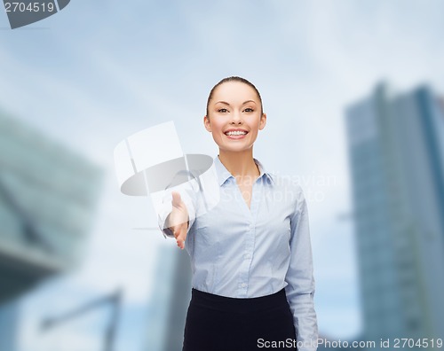 Image of businesswoman with opened hand ready for handshake