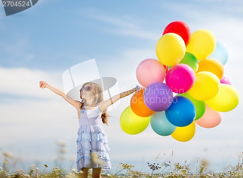Image of happy girl with colorful balloons