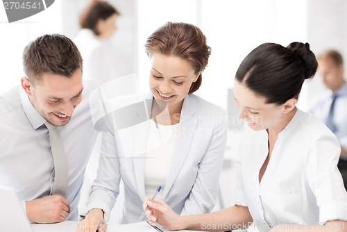 Image of business team having discussion in office