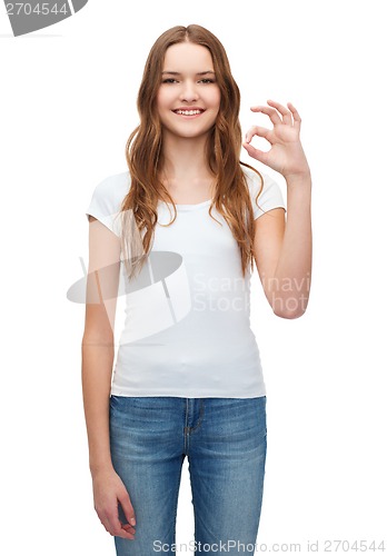 Image of woman in blank white t-shirt showing ok gesture