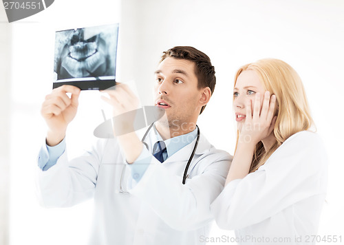 Image of two doctors looking at x-ray