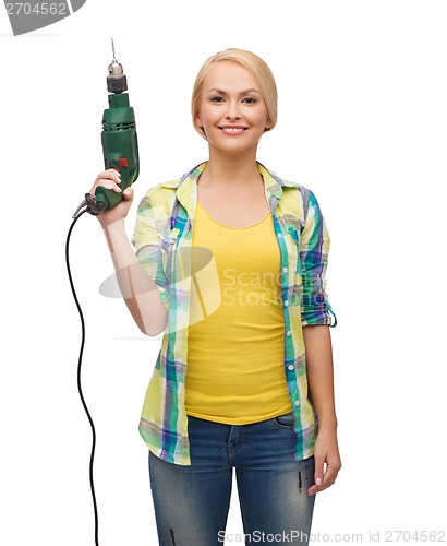 Image of smiling woman with drill machine