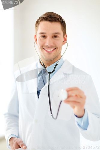 Image of smiling male doctor with stethoscope in hospital